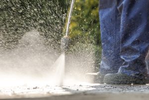 Alt Text: professional pressure washing outside concrete 